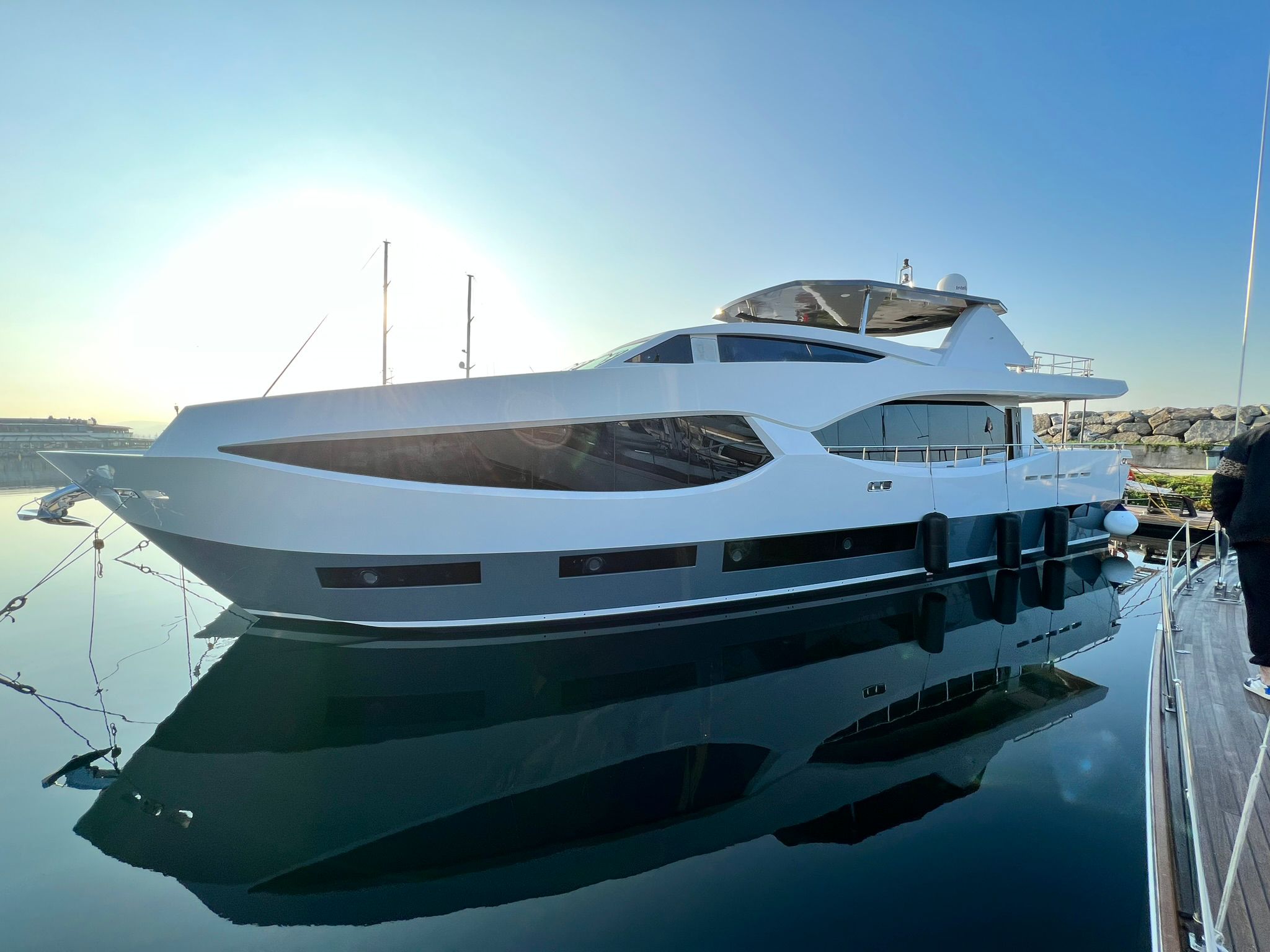 Luxury yacht reflected in a marina