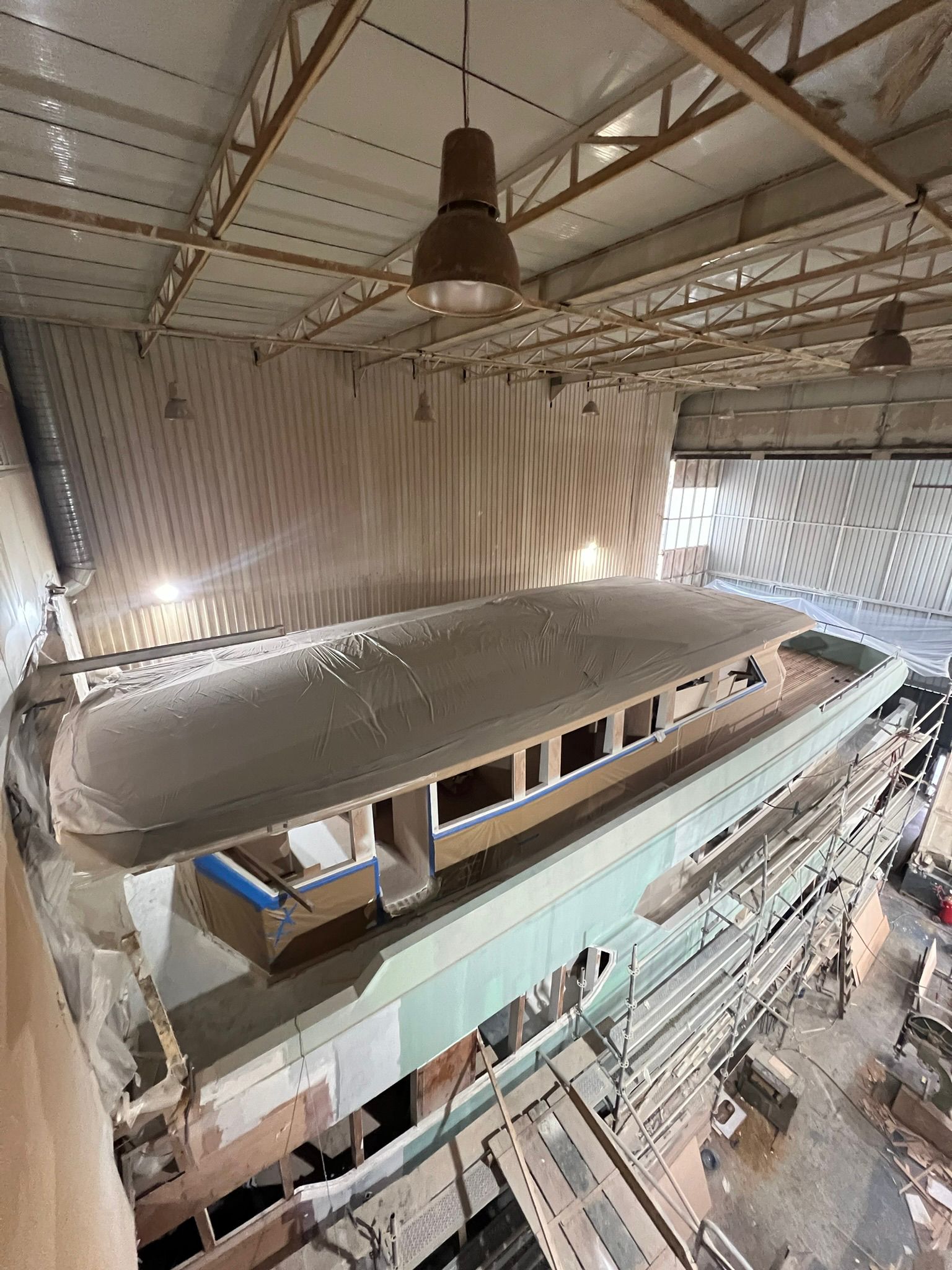 Yacht undergoing refit in a shipyard